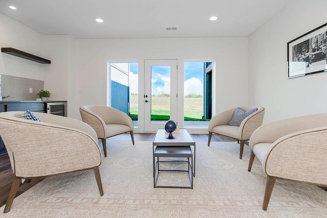 sitting room featuring light hardwood / wood-style floors