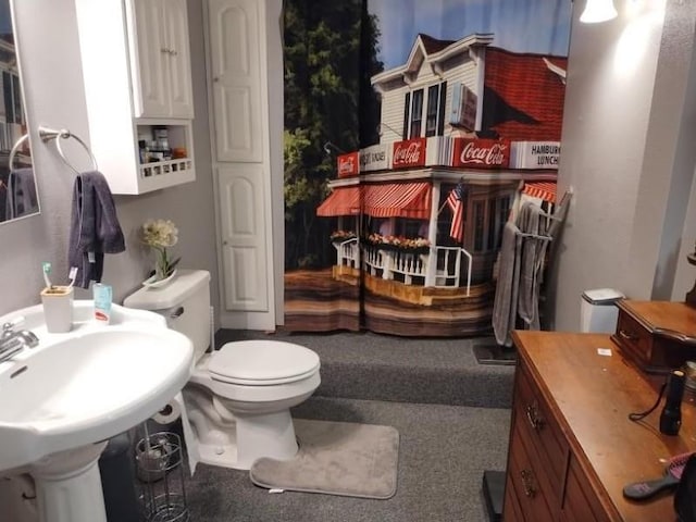 bathroom featuring sink and toilet