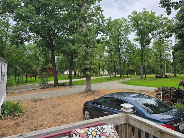 view of home's community featuring a lawn