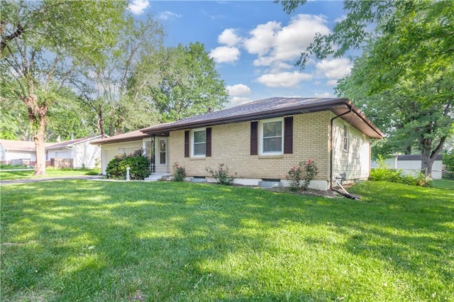 ranch-style home featuring entry steps, driveway, an attached garage, a front lawn, and brick siding