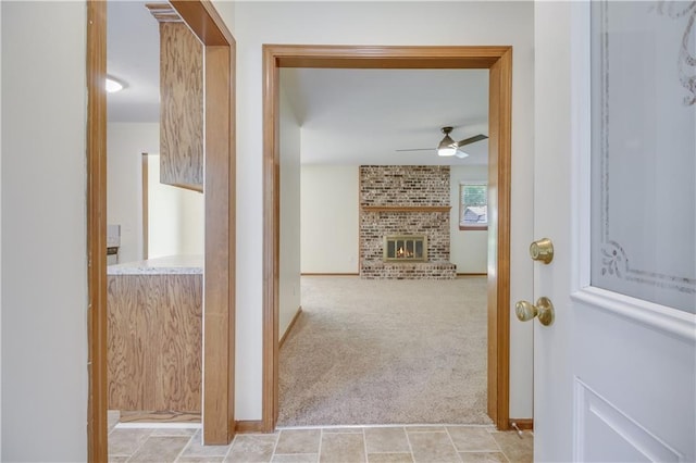 hallway featuring light carpet