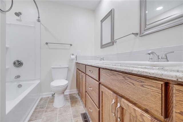 bathroom with visible vents, baseboards, toilet, vanity, and shower / bathtub combination