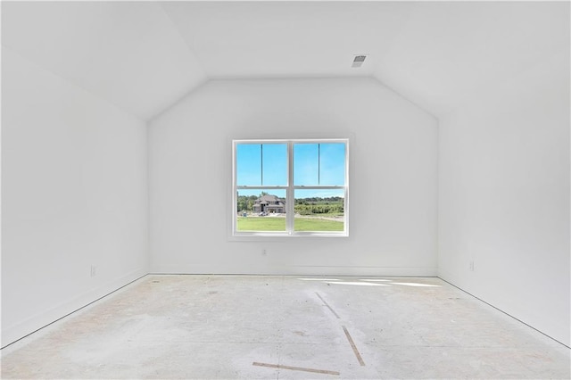 additional living space with visible vents and lofted ceiling