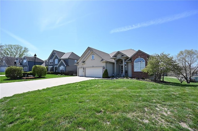 view of front of home featuring a front yard and a garage