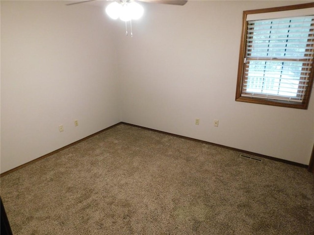 carpeted empty room with ceiling fan