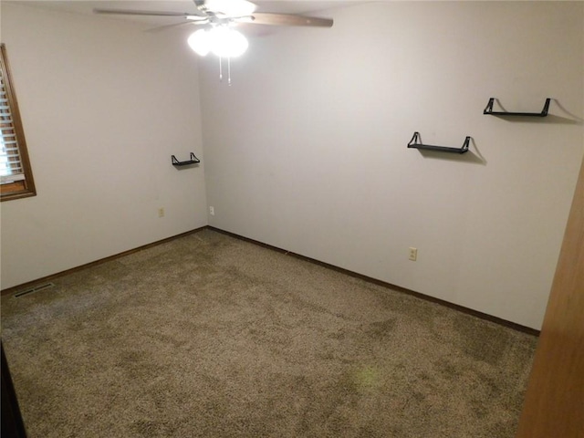 spare room with ceiling fan and carpet flooring