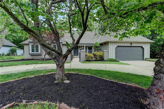 single story home with a garage and a front yard