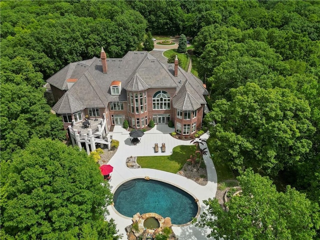 drone / aerial view featuring a view of trees