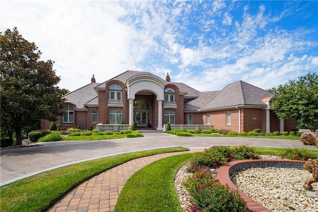 french provincial home with a chimney