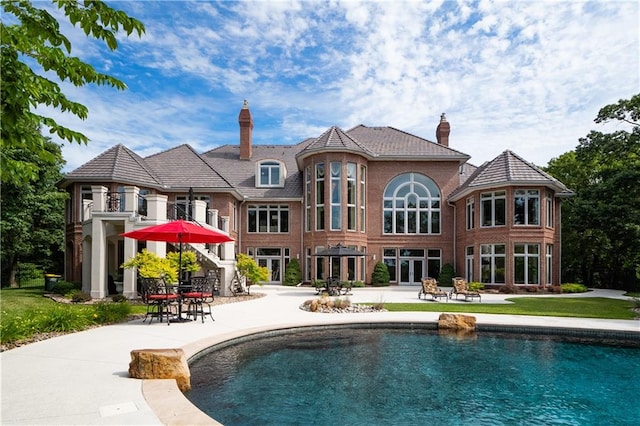 rear view of house with a patio