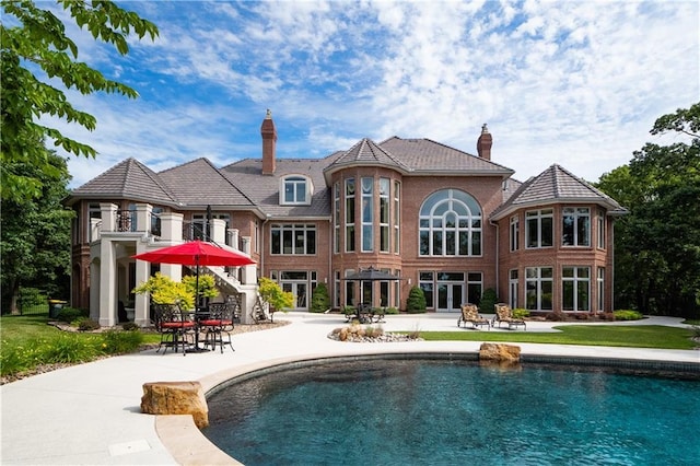 outdoor pool with a patio
