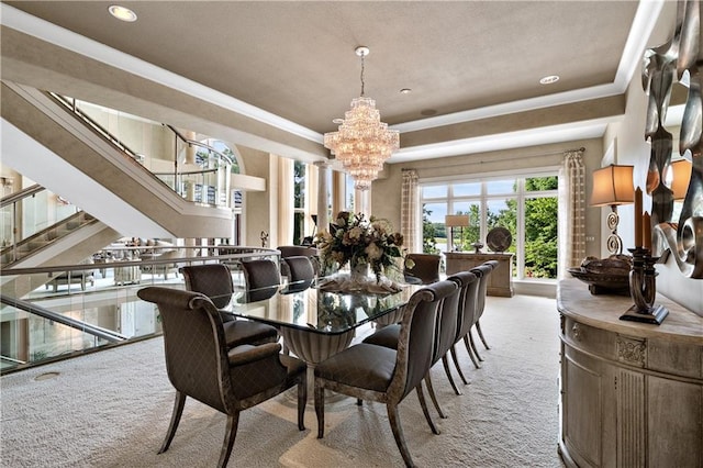 carpeted dining room featuring an inviting chandelier