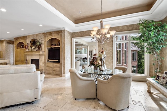 living room with a chandelier, built in shelves, a raised ceiling, and light tile patterned floors