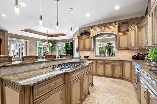 kitchen featuring light stone countertops, tasteful backsplash, stone tile floors, visible vents, and stainless steel appliances