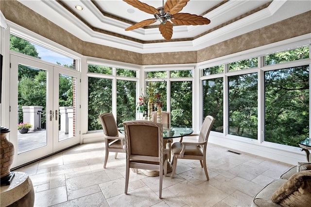 sunroom with ceiling fan, french doors, and a tray ceiling