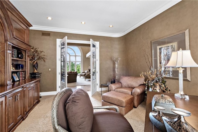 living room with light carpet, french doors, and ornamental molding