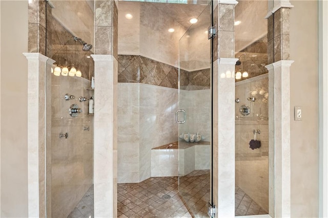 bathroom featuring a shower with door