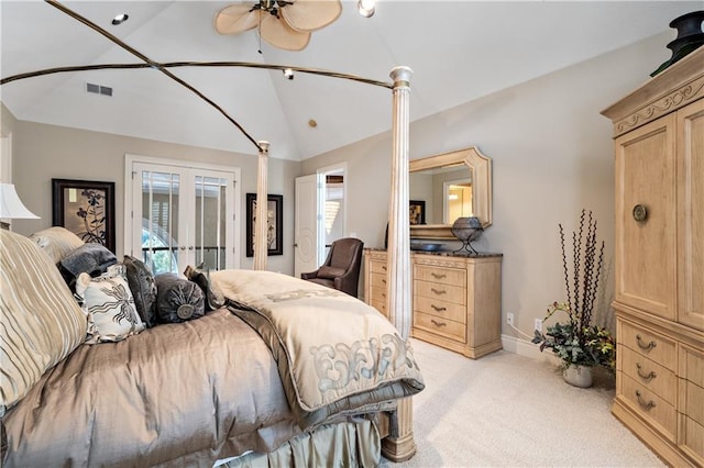 bedroom featuring visible vents, baseboards, french doors, light colored carpet, and lofted ceiling