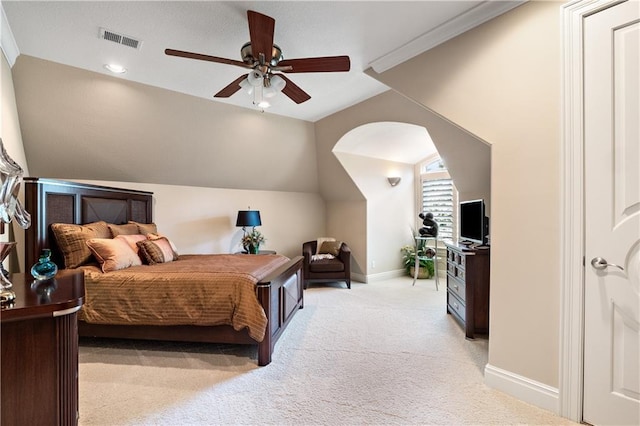 bedroom with visible vents, baseboards, ceiling fan, vaulted ceiling, and light carpet