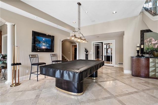 game room featuring decorative columns, light tile patterned floors, and billiards