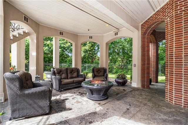 view of patio / terrace with visible vents, outdoor lounge area, and fence