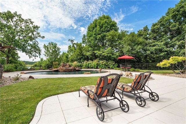 view of patio / terrace with an outdoor pool
