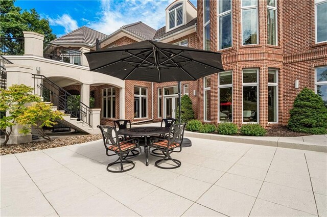 view of patio featuring stairway