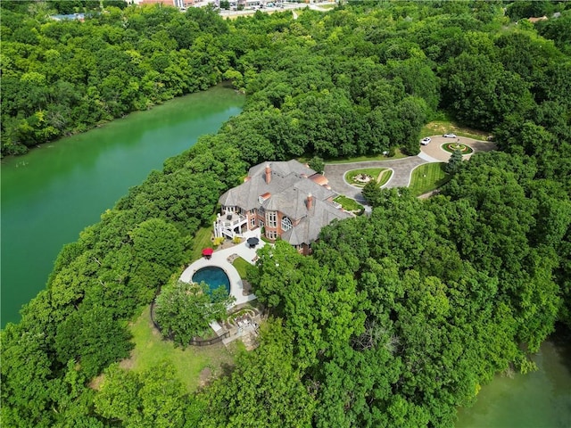 bird's eye view with a view of trees and a water view