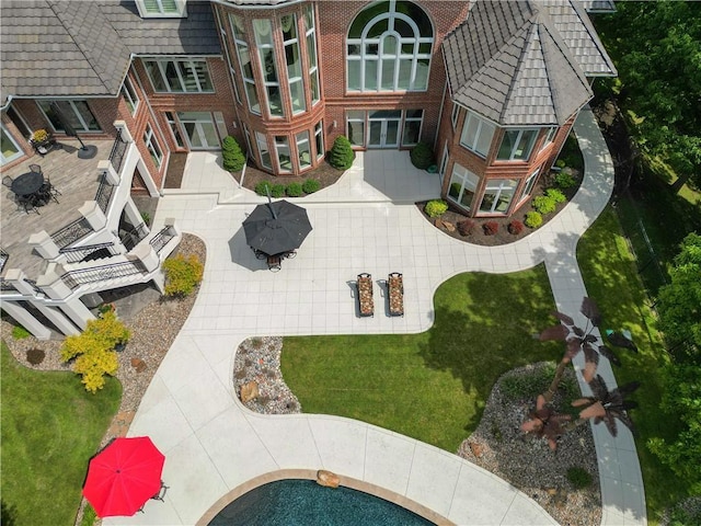 surrounding community with a patio area