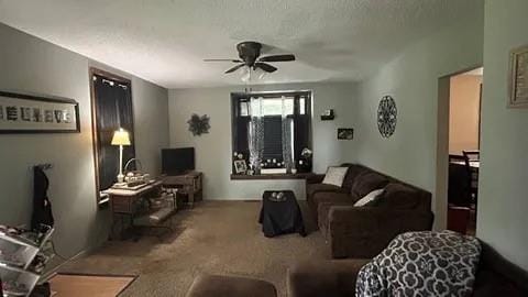 living room with carpet floors and ceiling fan