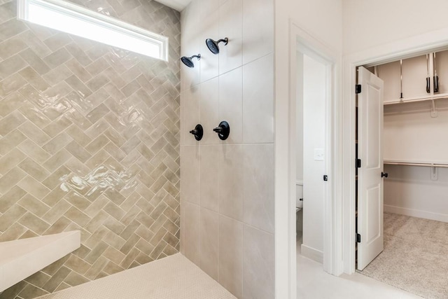 bathroom with tiled shower