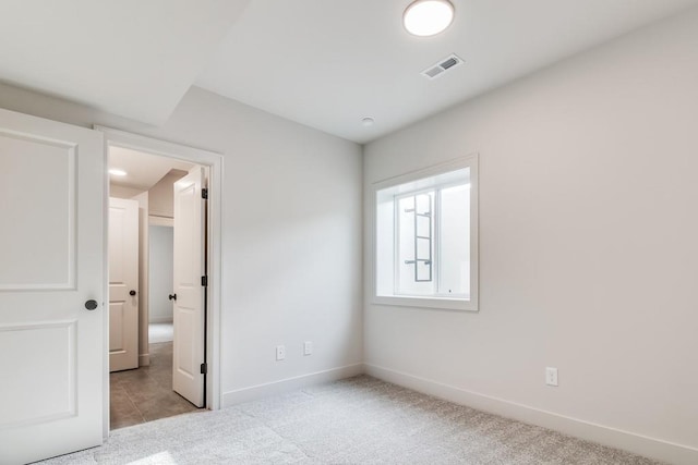 unfurnished bedroom featuring light colored carpet