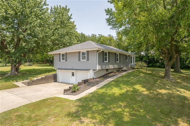 view of front of house with a garage and a front yard