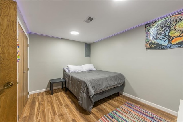 bedroom with light hardwood / wood-style flooring