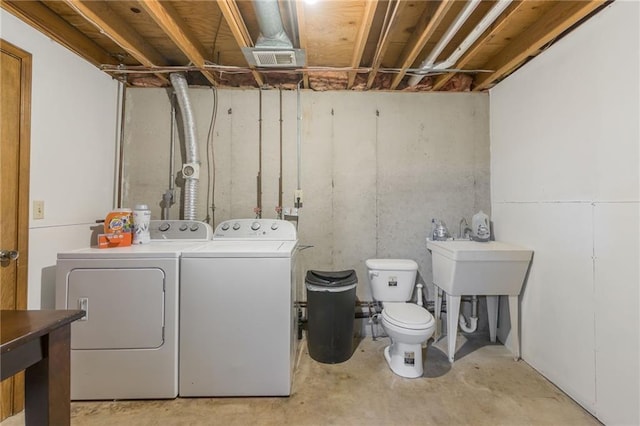 laundry area featuring washing machine and clothes dryer