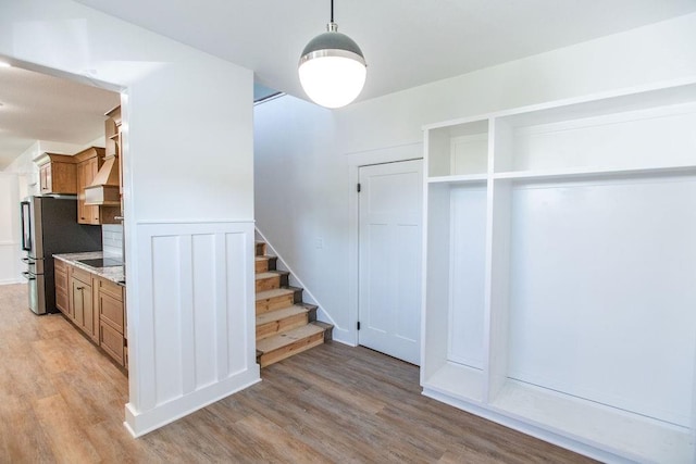 staircase featuring light hardwood / wood-style flooring