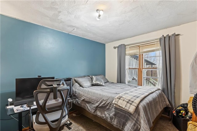 carpeted bedroom with a textured ceiling