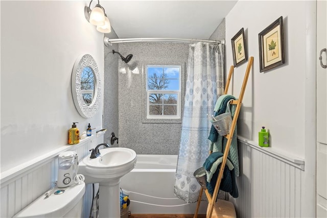 bathroom with shower / bath combo and toilet