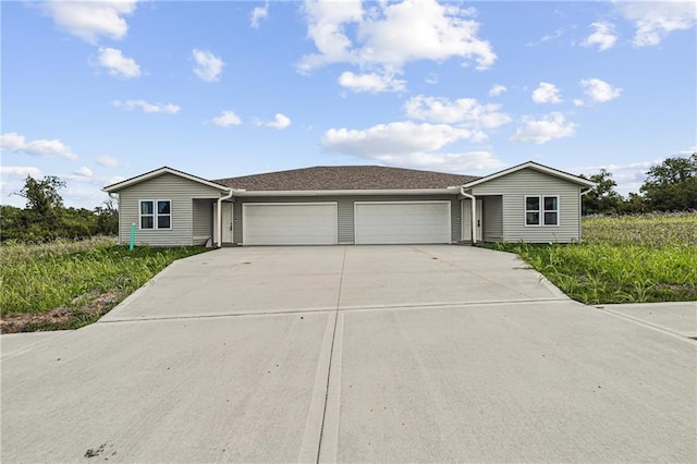 single story home featuring a garage