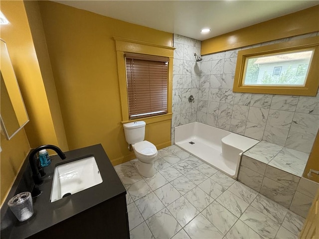 full bathroom featuring vanity, baseboards, a tile shower, toilet, and marble finish floor