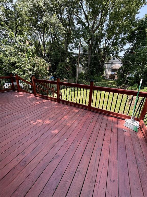 wooden deck with a yard