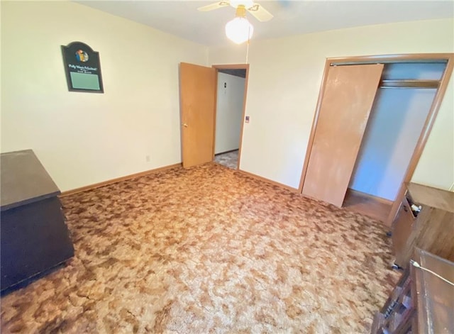 bedroom with carpet flooring, baseboards, a closet, and ceiling fan