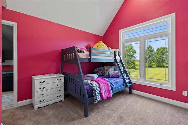 carpeted bedroom with vaulted ceiling