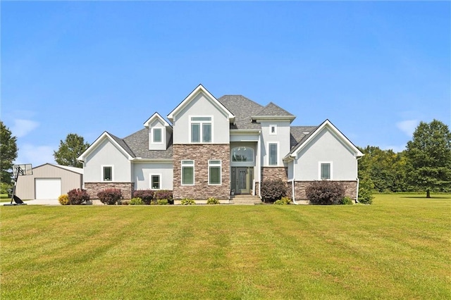 view of front of house with an outbuilding, stucco siding, a garage, stone siding, and a front lawn