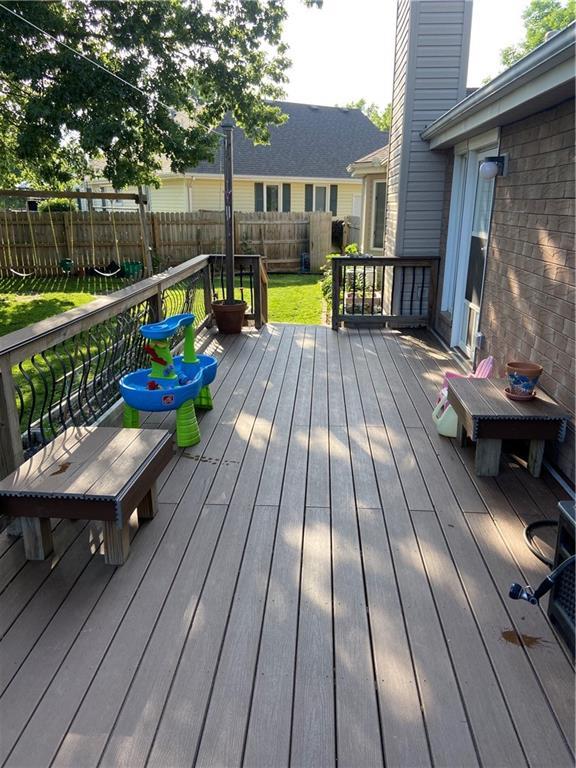 deck featuring a fenced backyard and a yard