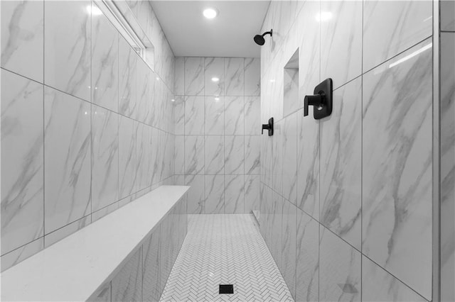 bathroom with tiled shower