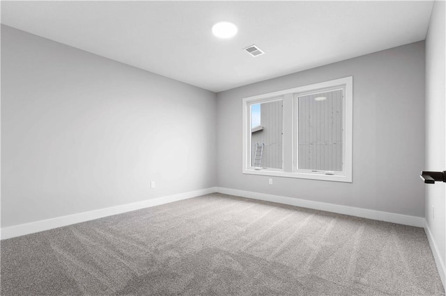 spare room featuring carpet flooring