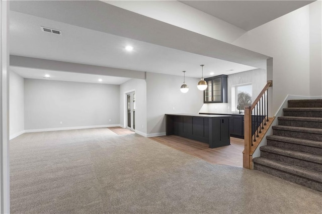 bar with sink and carpet