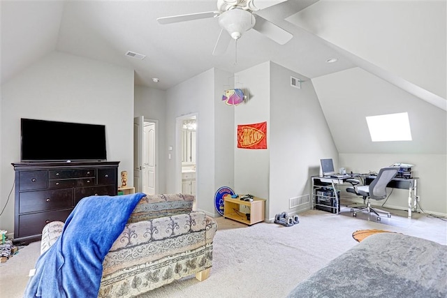 interior space featuring lofted ceiling with skylight and ceiling fan