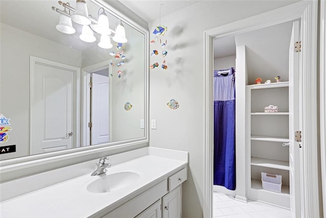 bathroom with tile patterned floors and vanity